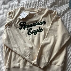American Eagle Outfitters Cream Sweatshirt with Green Logo